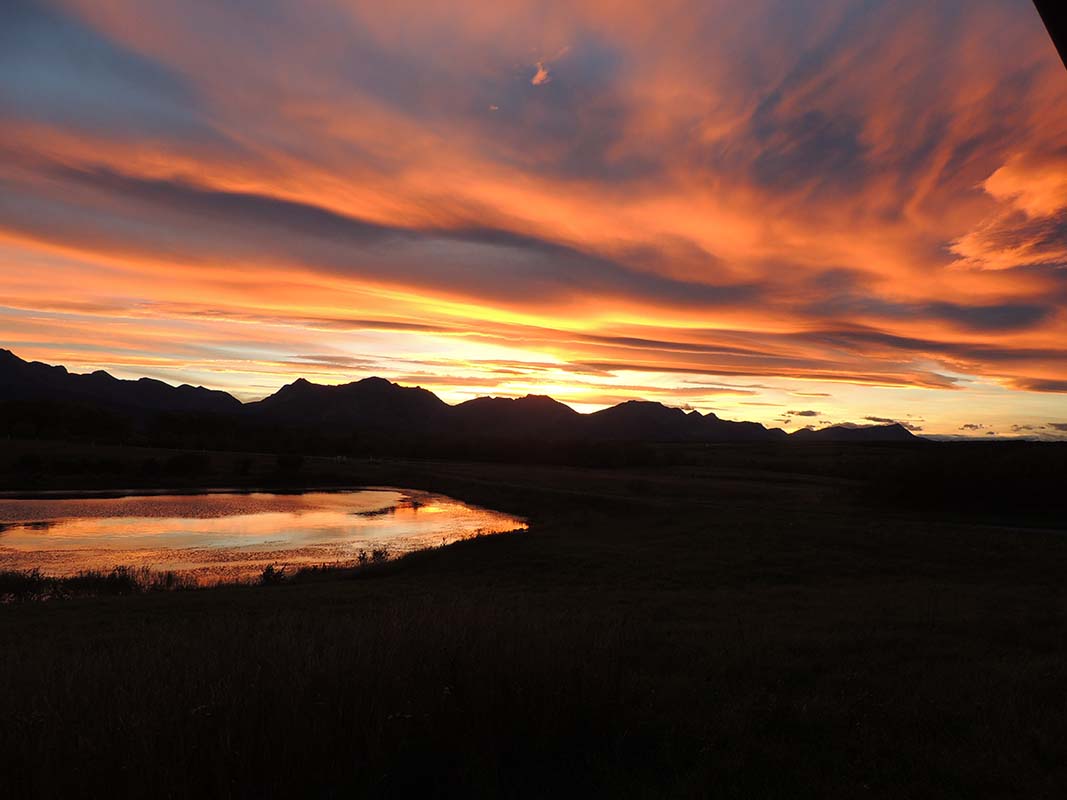 Vibrant sunset over the mountains at Dungarvan Creek Vacation Rentals